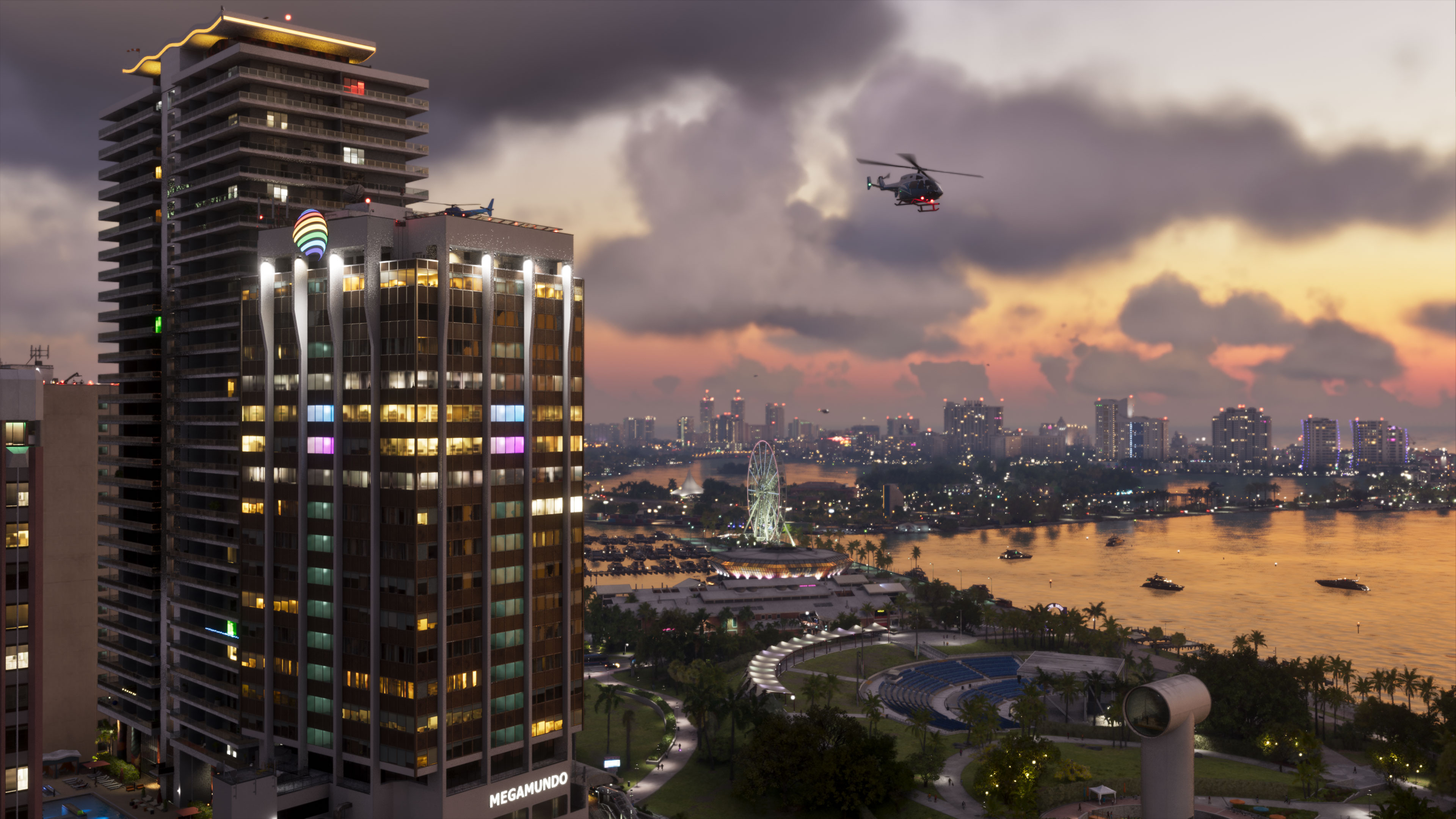 Officiële GTA VI-screenshot van Rockstar Games: een helikopter boven de skyline en het water van Vice City bij zonsondergang.